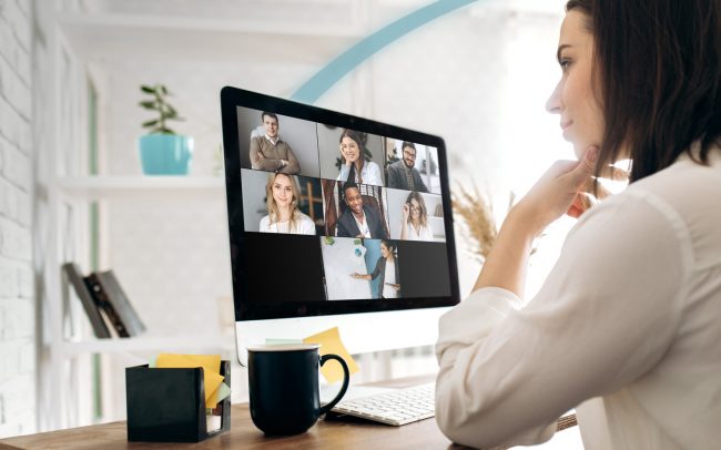 Lady having virtual zoom Fuse Webex Teams call with colleagues