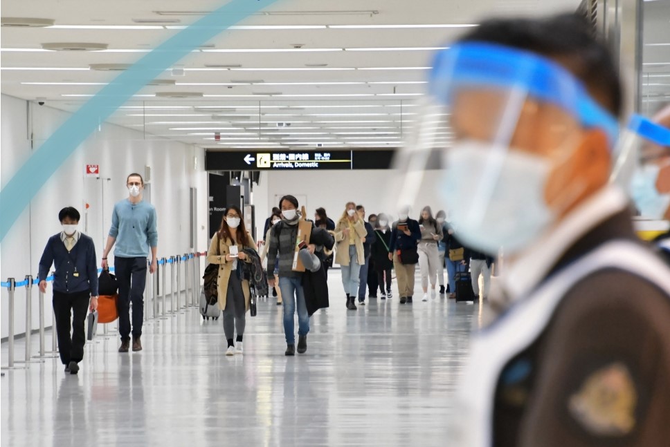 Travellers having to wear masks at an airport terminal during the COVID19 pandemic